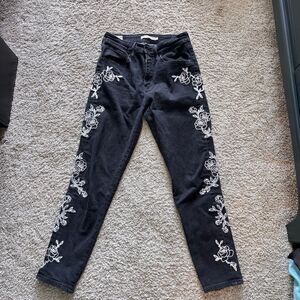 LEVI’s high rise jeans with embroidered leg flower pattern size 27